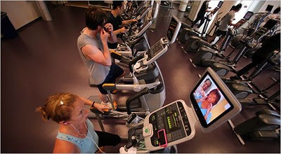 100824, Rhiana Maidenberg listened to an audio book on her mobile phone while watching television during a workout in San Francisco