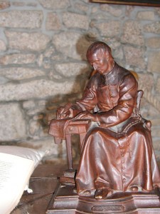 Sao Luis Maria Grignon de Montfort escrevendo o Tratado